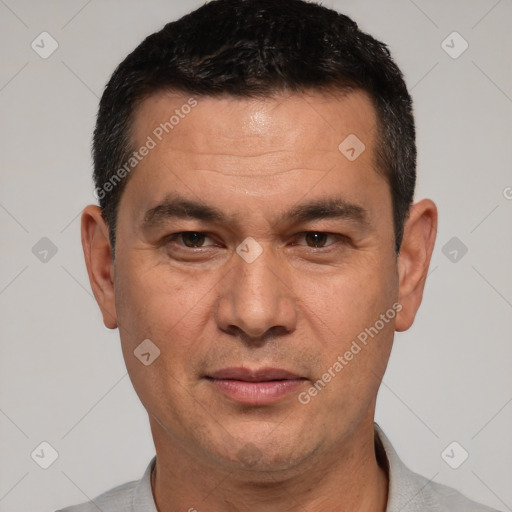 Joyful white adult male with short  black hair and brown eyes