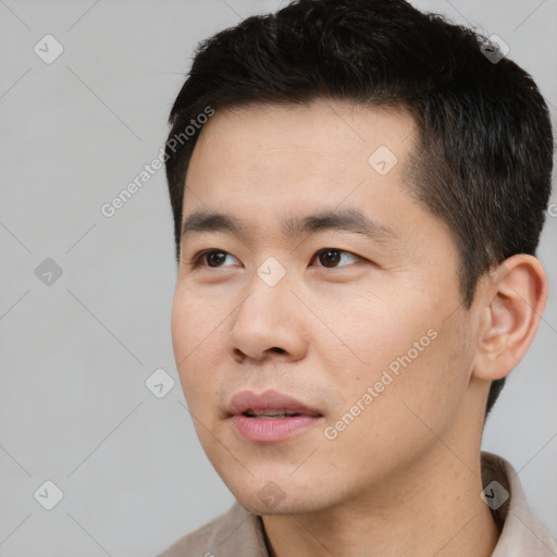 Neutral white young-adult male with short  black hair and brown eyes