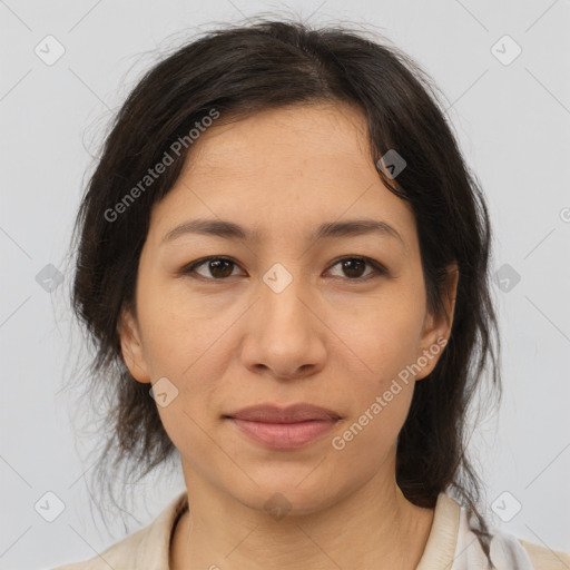 Joyful latino adult female with medium  brown hair and brown eyes