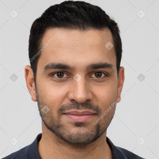 Joyful white young-adult male with short  black hair and brown eyes