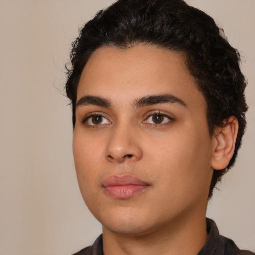 Neutral white young-adult male with short  black hair and brown eyes