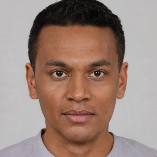 Neutral black young-adult male with short  black hair and brown eyes