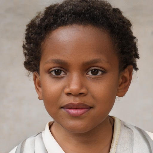 Joyful black child female with short  brown hair and brown eyes