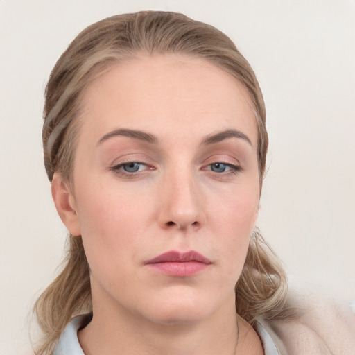 Neutral white young-adult female with medium  brown hair and grey eyes