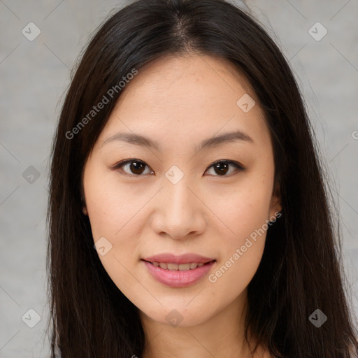 Joyful asian young-adult female with long  brown hair and brown eyes