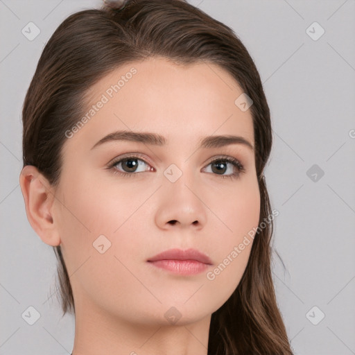 Neutral white young-adult female with long  brown hair and brown eyes