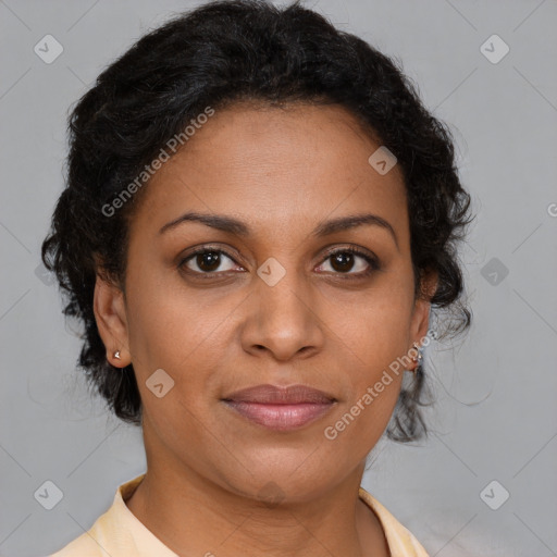 Joyful latino adult female with short  brown hair and brown eyes