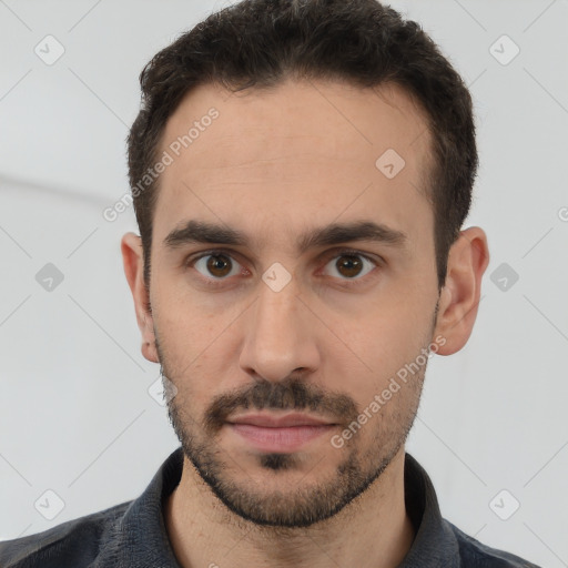 Neutral white young-adult male with short  black hair and brown eyes