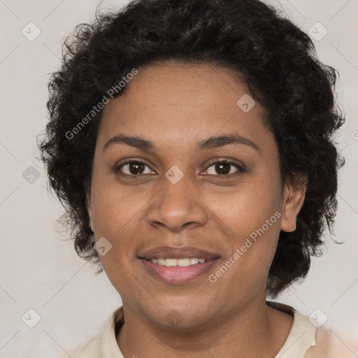 Joyful black adult female with short  brown hair and brown eyes