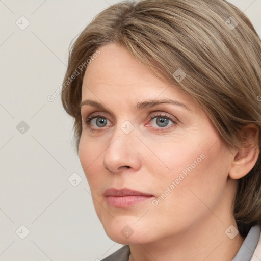 Neutral white young-adult female with medium  brown hair and grey eyes