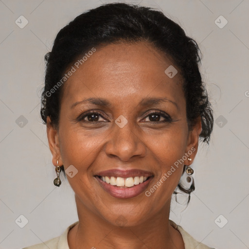 Joyful latino adult female with medium  brown hair and brown eyes