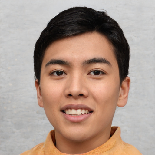 Joyful asian young-adult male with short  black hair and brown eyes