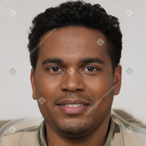 Joyful black young-adult male with short  brown hair and brown eyes