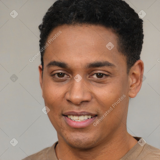 Joyful black young-adult male with short  black hair and brown eyes