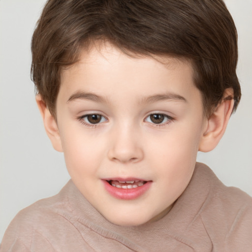 Joyful white child male with short  brown hair and brown eyes