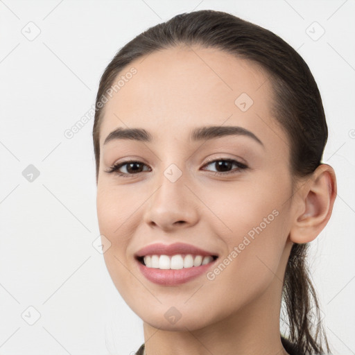 Joyful white young-adult female with long  brown hair and brown eyes