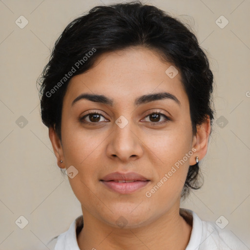 Joyful latino young-adult female with short  brown hair and brown eyes