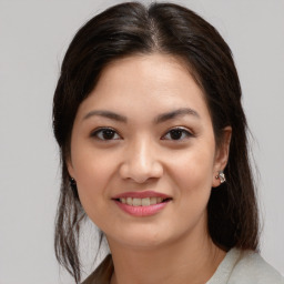 Joyful asian young-adult female with medium  brown hair and brown eyes