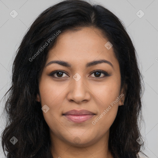 Joyful latino young-adult female with long  brown hair and brown eyes