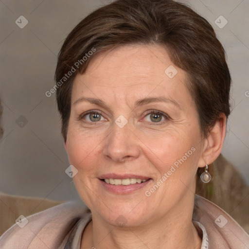 Joyful white adult female with medium  brown hair and grey eyes