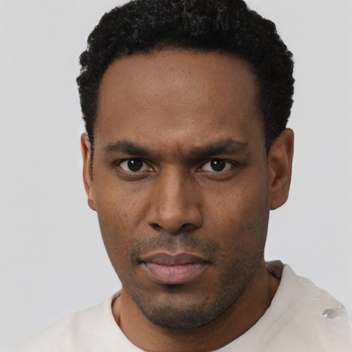 Neutral black young-adult male with short  black hair and brown eyes