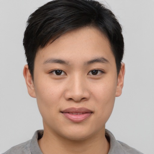 Joyful asian young-adult female with short  black hair and brown eyes