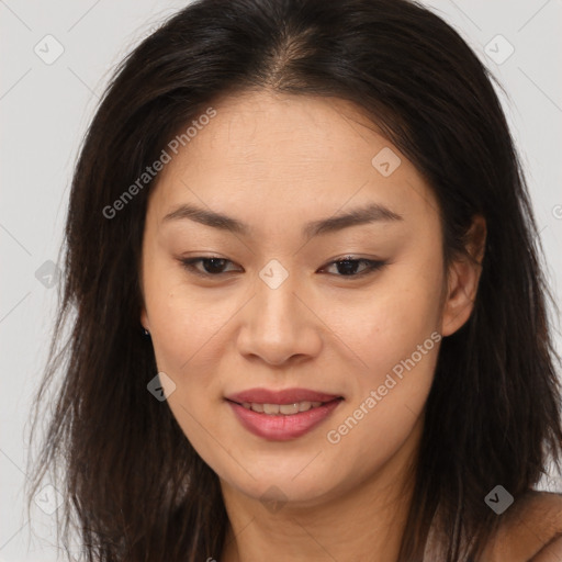 Joyful asian young-adult female with long  brown hair and brown eyes