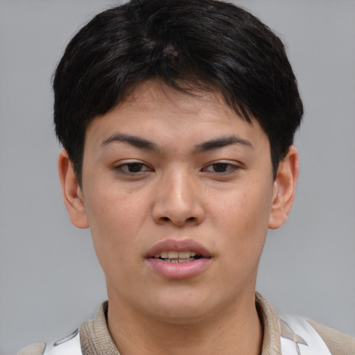 Joyful asian young-adult female with short  brown hair and brown eyes