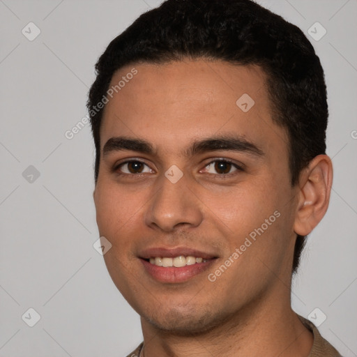 Joyful white young-adult male with short  black hair and brown eyes