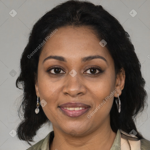 Joyful black adult female with medium  brown hair and brown eyes