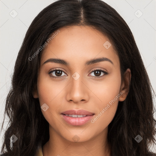 Joyful latino young-adult female with long  brown hair and brown eyes