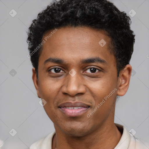 Joyful black young-adult male with short  black hair and brown eyes