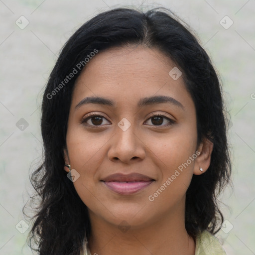 Joyful latino young-adult female with long  brown hair and brown eyes