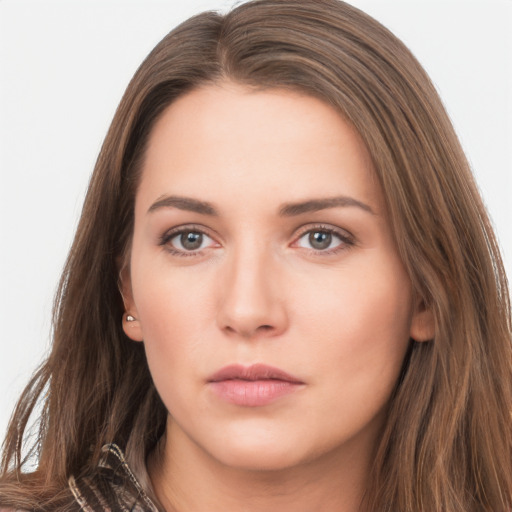 Neutral white young-adult female with long  brown hair and brown eyes