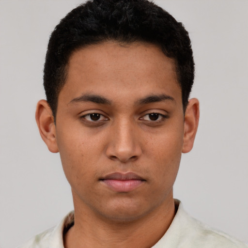Neutral latino young-adult male with short  brown hair and brown eyes