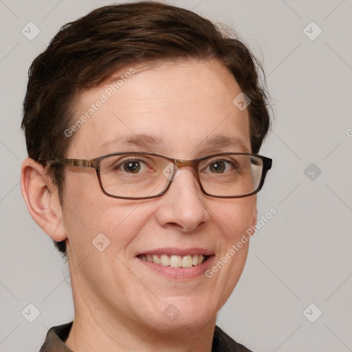 Joyful white adult female with short  brown hair and grey eyes