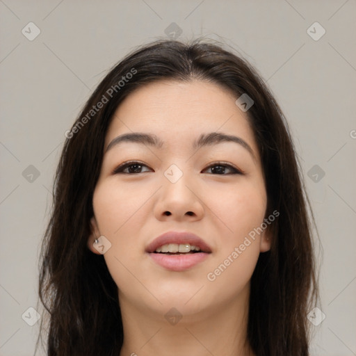 Joyful asian young-adult female with long  brown hair and brown eyes