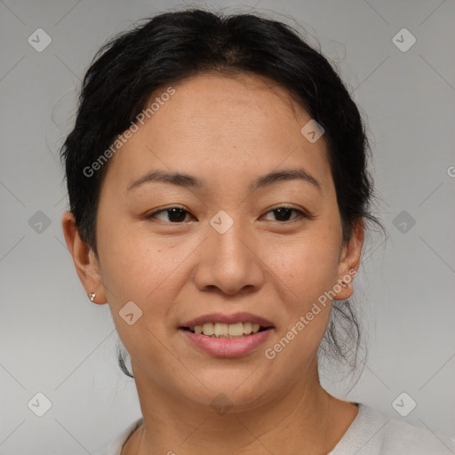 Joyful asian adult female with short  brown hair and brown eyes