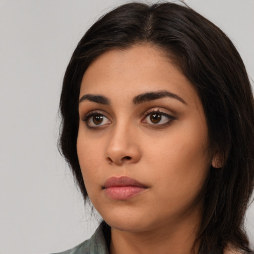 Neutral latino young-adult female with long  black hair and brown eyes