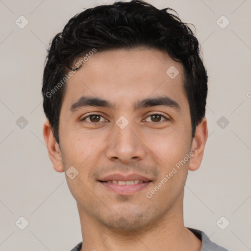 Joyful white young-adult male with short  black hair and brown eyes