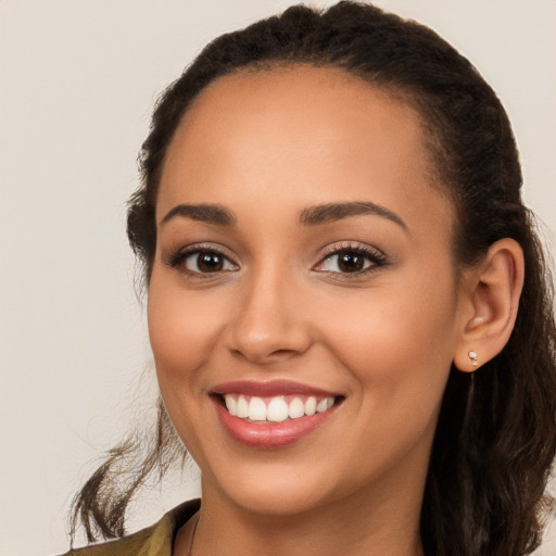 Joyful white young-adult female with long  brown hair and brown eyes