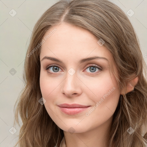 Joyful white young-adult female with long  brown hair and blue eyes