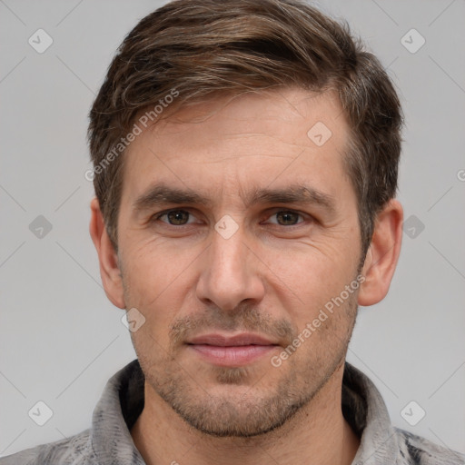 Joyful white adult male with short  brown hair and brown eyes