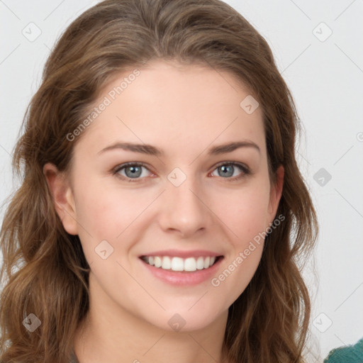 Joyful white young-adult female with long  brown hair and green eyes