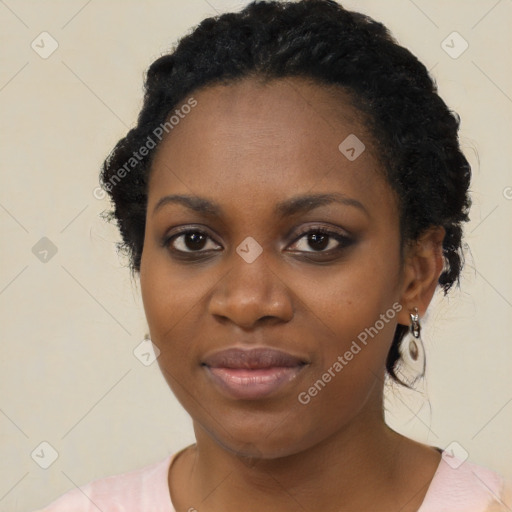 Joyful black young-adult female with medium  black hair and brown eyes