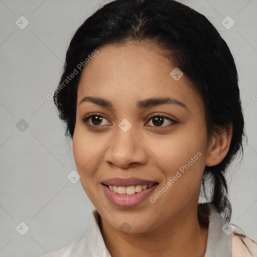 Joyful latino young-adult female with medium  black hair and brown eyes