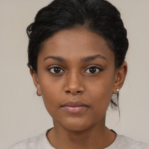 Neutral black child female with short  black hair and brown eyes