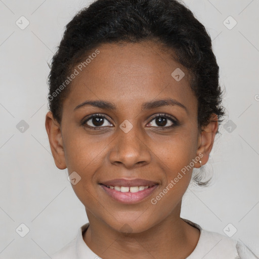 Joyful black young-adult female with short  brown hair and brown eyes