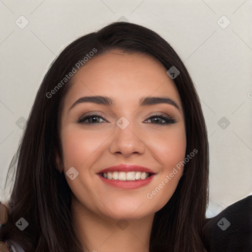 Joyful white young-adult female with long  black hair and brown eyes