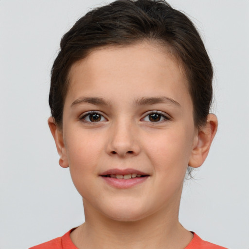 Joyful white child female with short  brown hair and brown eyes